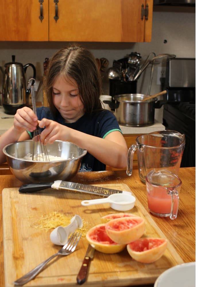 image of girl mixing grapefruit cake batter