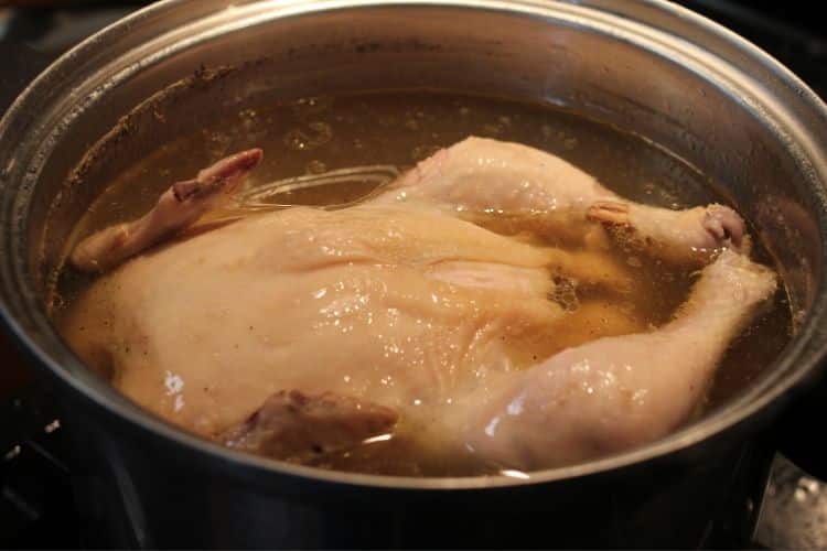 image of cooking a chicken for chicken enchiladas