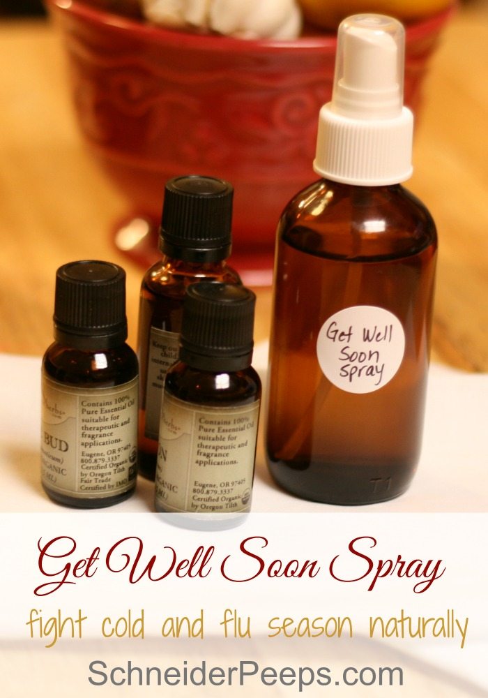 image of antimicrobial disinfectant spray in brown spray bottle with bottles of essential oils around it