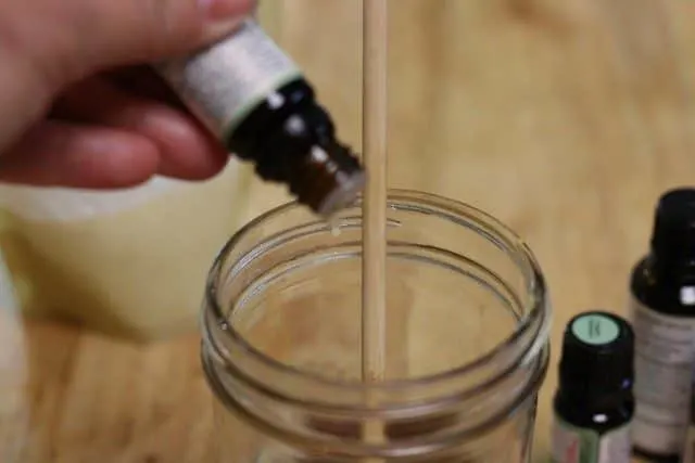 image of adding essential oils to homemade vapor rub