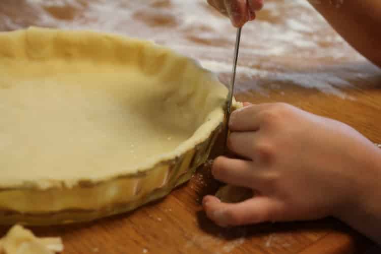 image of trimming pie crust on pie