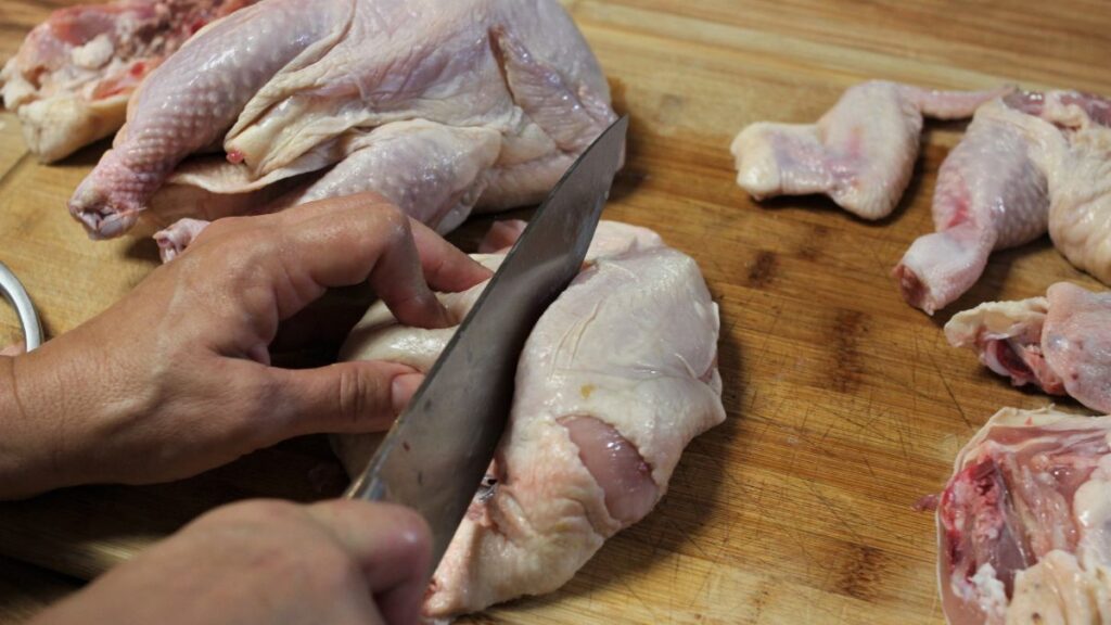 Cutting chicken breasts in half